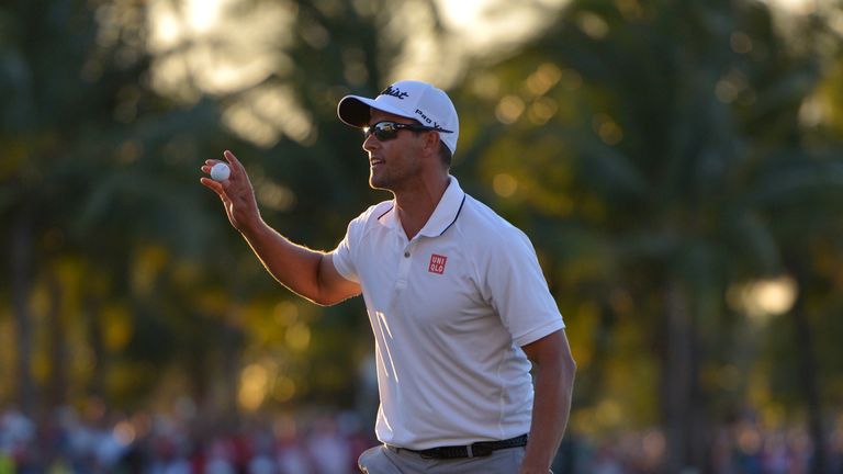 Adam Scott of Australia  reacts after putting in to win on the 18th hole