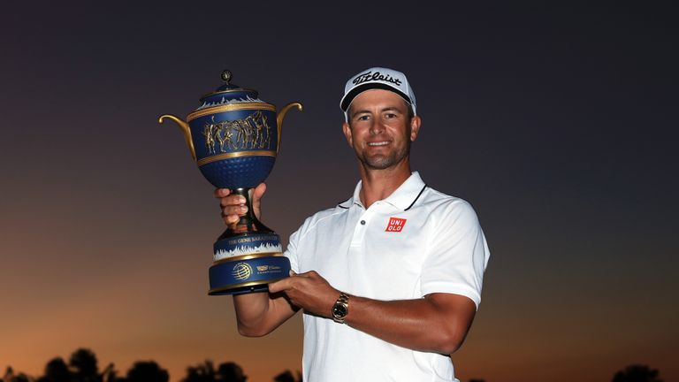 Adam Scott of Australia proudly holds the trophy after his one-shot win in the final round of the 2016 World Golf Championship Cadillac Championship