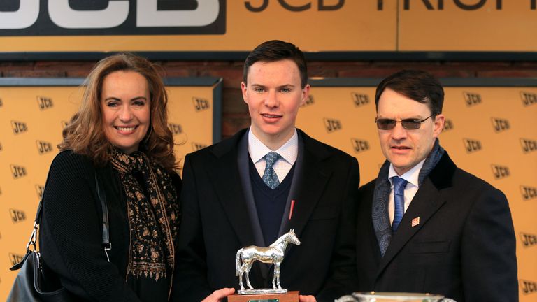Joseph O'Brien (centre), son of winning trainer Aidan O'Brien (right) with their trophy after Ivanovich Gorbatov won the JCB Triumph Hurdle