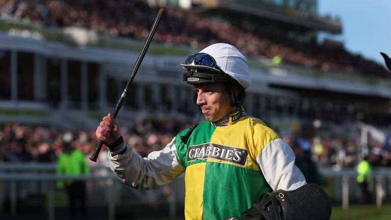 Leighton Aspell celebrates after winning the 2015 Crabbie's Grand National on  Many Clouds at Aintree 