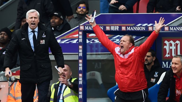 Alan Pardew manager of Crystal Palace (L) and Andy Woodman goalkeeping coach of Crystal Palace react during the Barclays Premi