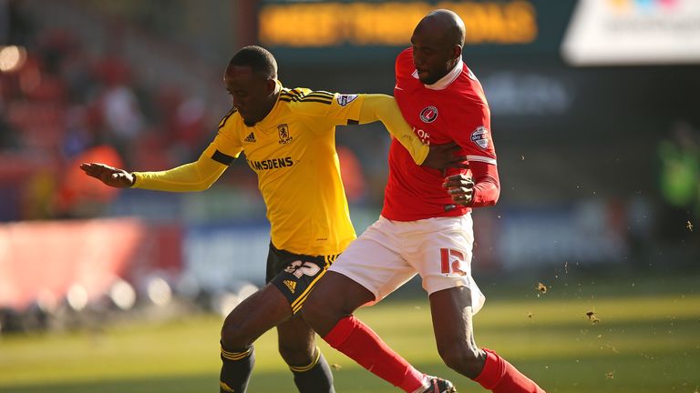 Albert Adomah of Middlesbrough holds off the challenge of Alou Diarra of Charlton