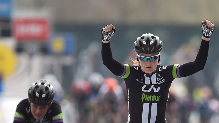 Amy Pieters celebrates as she crosses the finish line to win the women's Dwars Door Vlaanderen in 2015