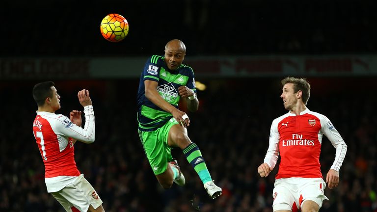 Swansea's Andre Ayew wins a header against Arsenal