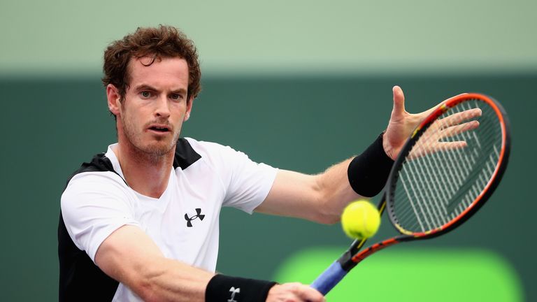Andy Murray of Great Britain plays a backhand against Grigor Dimitrov of Bulgaria