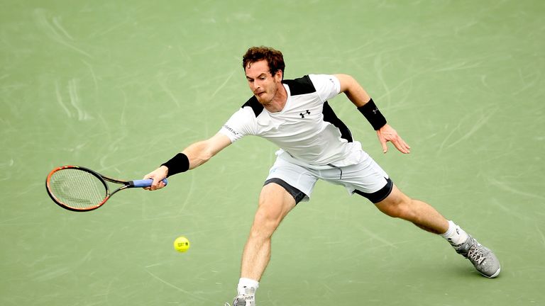 Andy Murray of Great Britain returns a shot to Grigor Dimitrov of Bulgaria