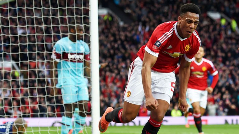 West Ham 'keeper Darren Randolph is grounded in the goal as Anthony Martial celebrates