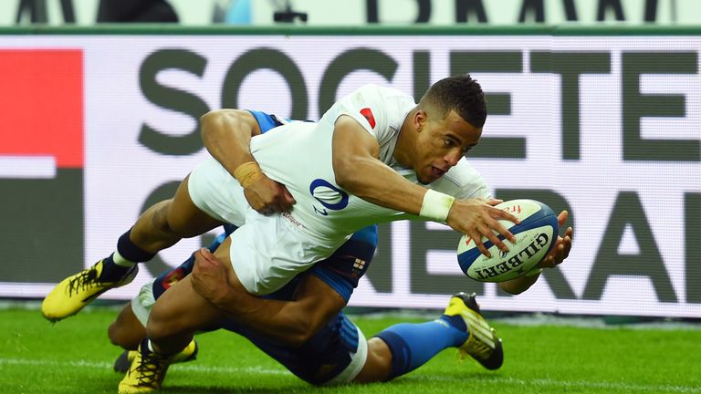  Anthony Watson of England scores his team's third try despite the tackled from Wesley Fofana 