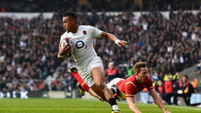 Anthony Watson of England evades a tackle from Liam Williams of Wales to score his team's opening try during the RBS Six Nations match at Twickenham