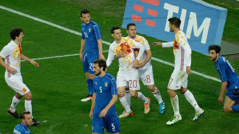 Aritz Aduriz scored his first goal for Spain at the age of 35 to give the European champions a fortuitous 1-1 draw away in Italy.