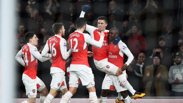 Joel Campbell (far right) celebrates with team-mates after scoring Arsenal's opening goal against Swansea