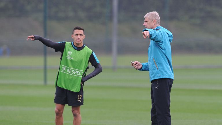 Arsenal manager Arsene Wenger with Alexis Sanchez
