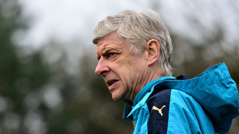 ST ALBANS, ENGLAND - MARCH 15:  Arsene Wenger, Manager of Arsenal walks out for a training session ahead of the UEFA Champions League round of 16 second le