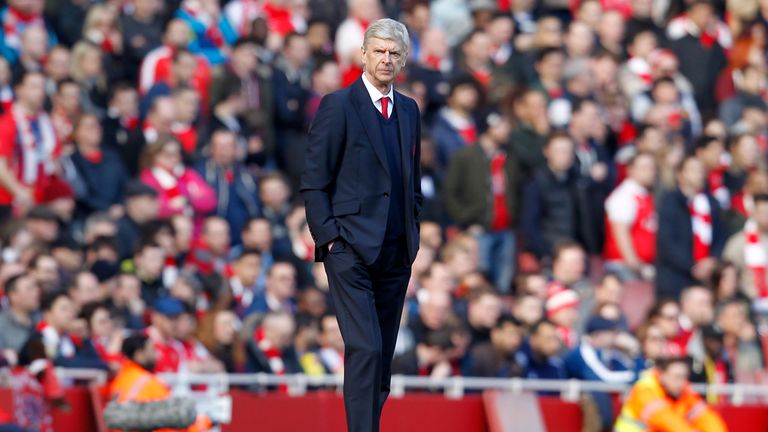 Arsenal's French manager Arsene Wenger watches his players