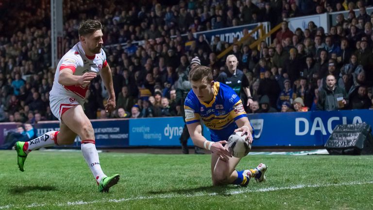  Leeds' Ash Handley touches down for a try against St Helens