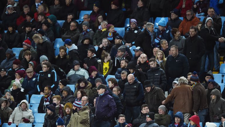 Angry Aston Villa supporters leave the stand in the middle of second half against Everton