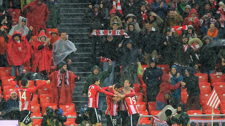 Athletic Bilbao's players celebrate after scoring during the UEFA Europa League Round of 16 first leg football match Athletic Clu