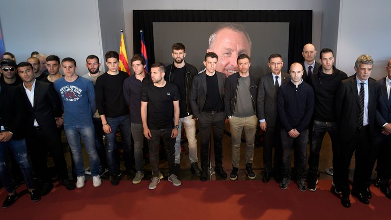 FC Barcelona players and coach pose as they pay tribute to late Dutch football star Johan Cruyff in a special condolence area set up at Camp 