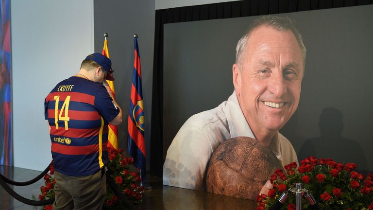 A FC Barcelona's football fan pays tribute to late Dutch football star Johan Cruyff in a special condolence area set up at Camp Nou stadium
