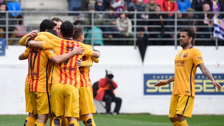 Barcelona defender Dani Alves (R) joins his teammates as they celebrate after scoring against Eibar