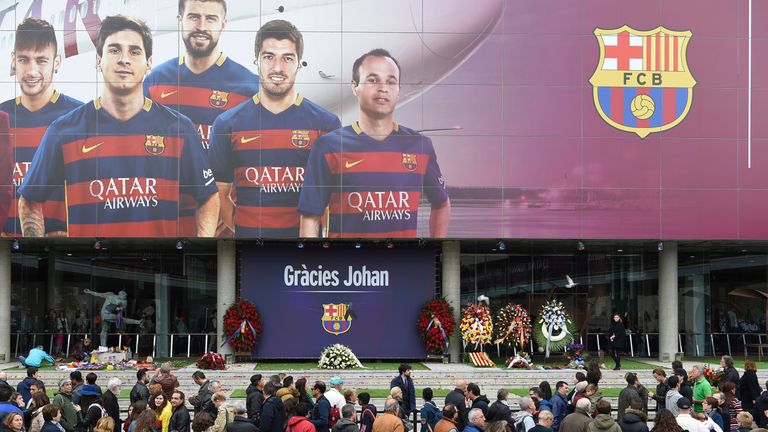 Football fans queue to pay tribute to late Dutch football star Johan Cruyff in a special condolence area set up at Camp Nou stadium