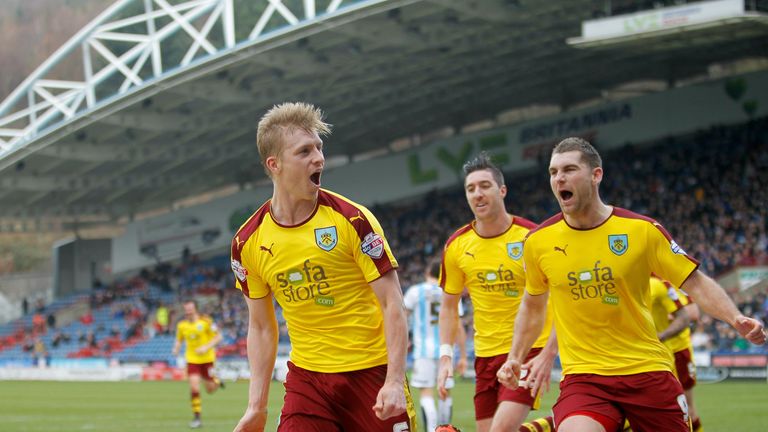 Burnley's Ben Mee (left) celebrates scoring his side's third goal of the game with team-mates Sam Vokes (right) and Stephen Ward 