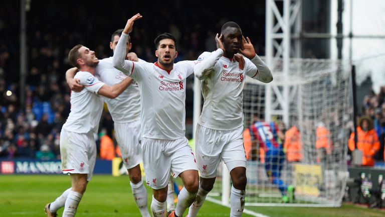 Christian Benteke of Liverpool (R) celebrates with team mates as he scores their second goal from the penalty spot during the 