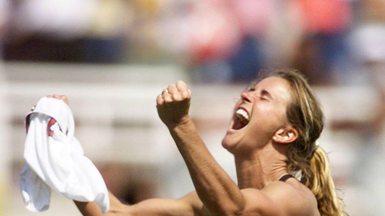 Brandi Chastain of the US celebrates after kicking the winning penalty shot to win the 1999 Women's World Cup final against China 10 July 1999