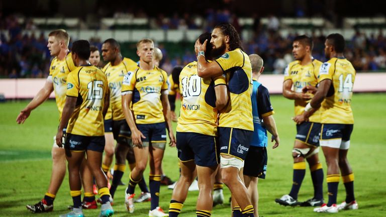 The Brumbies celebrate after their victory over the Force