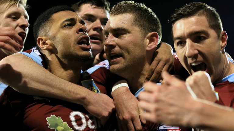 Burnley players celebrate after Sam Vokes scores his side's first goal 