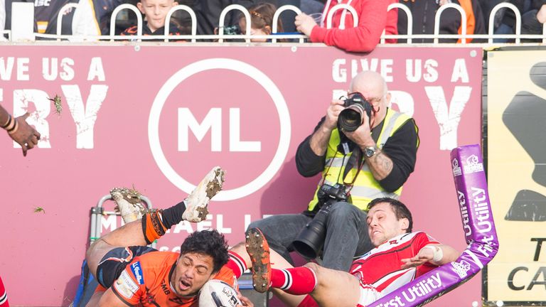 Castleford Tigers v Salford Red Devils - Castleford's Denny Solomona is stopped short of the try line by Salford's Gareth O'Brien.