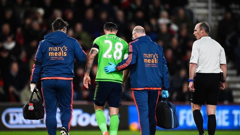 Charlie Austin leaves the pitch after damaging a hamstring during Southampton's defeat at Bournemouth