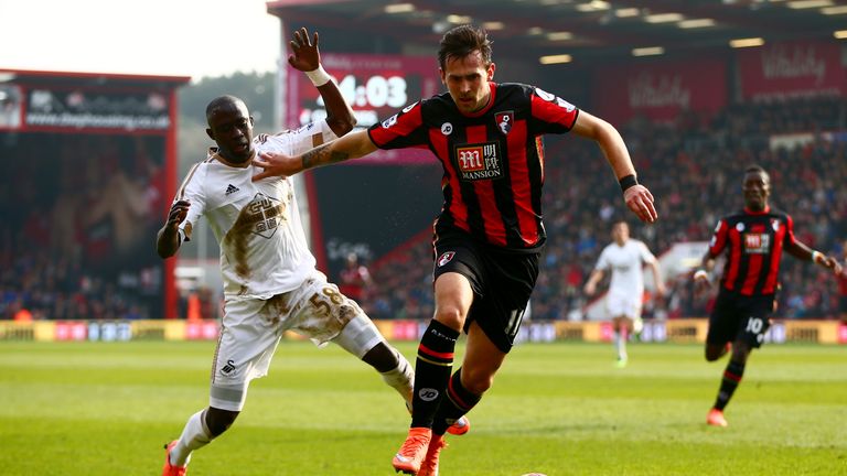 Charlie Daniels of Bournemouth and Modou Barrow of Swansea City compete for the ball