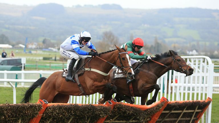 Unowhatimeanharry (right), ridden by Noel Fehily, jumps the last alongside Barters Hill in the Albert Bartlett at Cheltenham
