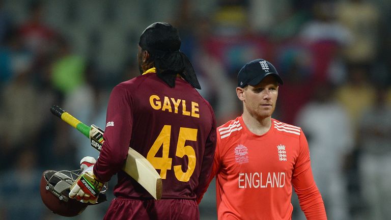 Chris Gayle of the West Indies shakes hands with England captain Eoin Morgan after the match in Mumbai