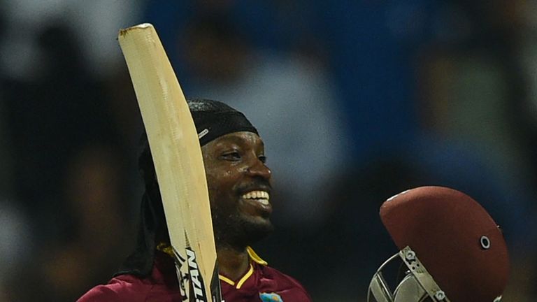 Chris Gayle celebrates after scoring his century against England