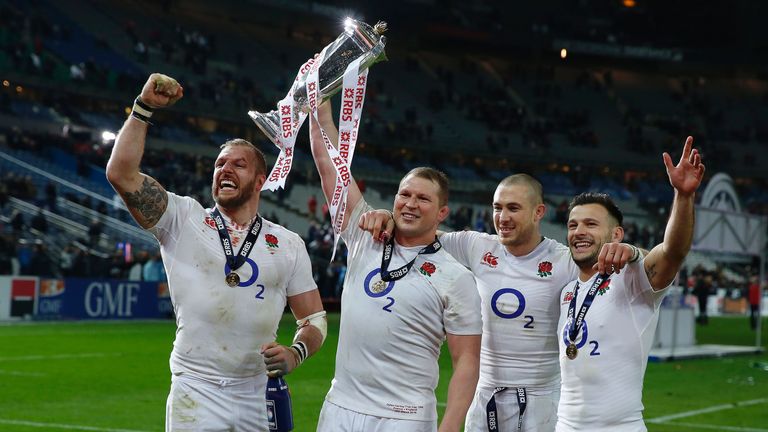 England's hooker and captain Dylan Hartley holds the trophy next to James Haskell, Mike Brown and Danny Care