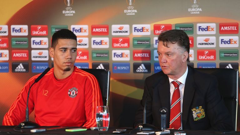 Chris Smalling listens to Manchester United manager Louis van Gaal