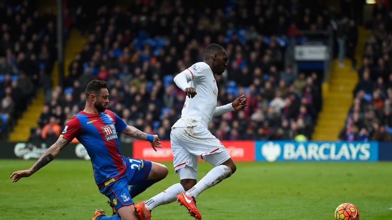 Damien Delaney of Crystal Palace fouls Christian Benteke of Liverpool to concede a penalty during the Barclays Premier League 