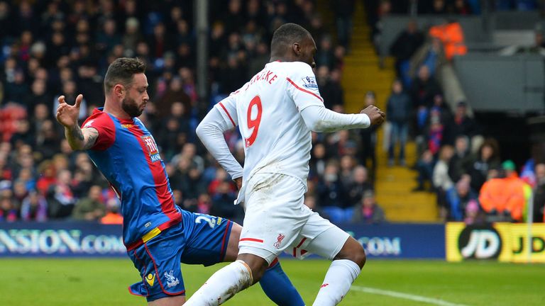 Christian Benteke (R) fell in the box under a challenge from Damien Delaney