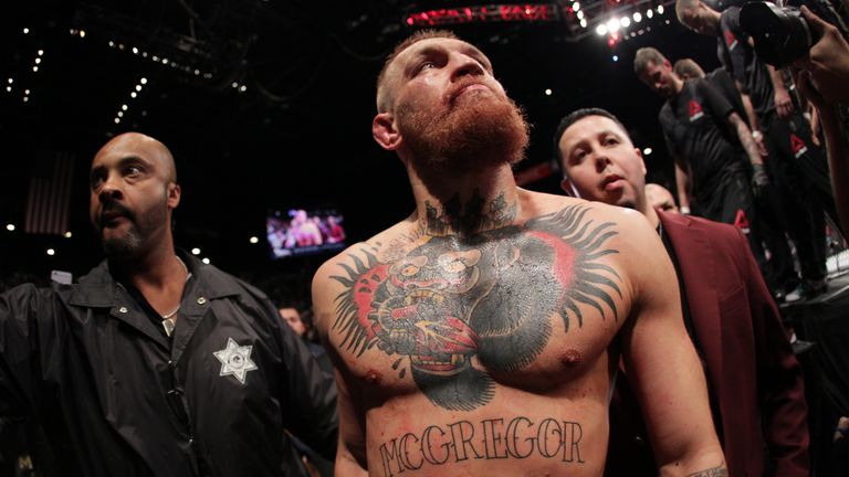 Conor McGregor exits the Octagon after his fight against Nate Diaz in their welterweight bout during the UFC 196 at the MGM Grand