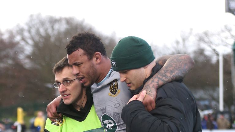 Courtney Lawes of Northampton is carried off the pitch