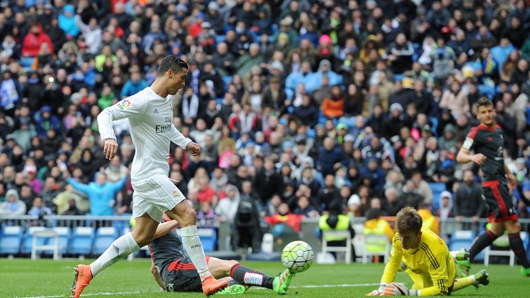 Cristiano Ronaldo of Real Madrid scores his 3rd goal against Ruben Blanco of Celta Vigo during the La Liga match