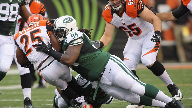 Damon Harrison #94 of the New York Jets tackles Giovani Bernard #25 of the Cincinnati Bengals during their game at Paul Brown 