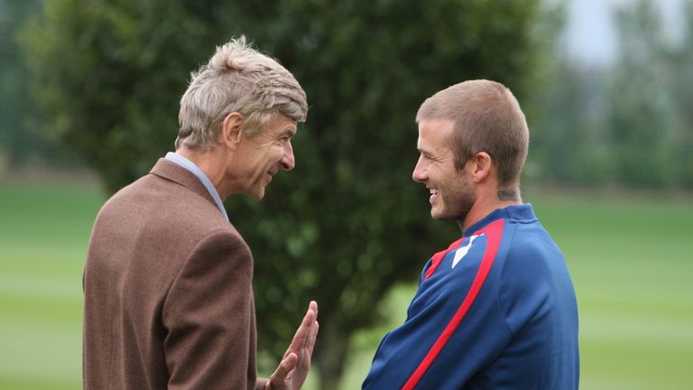 LONDON COLNEY, UNITED KINGDOM - AUGUST 20: Arsenal manager Arsene Wenger speaks with England's David Beckham during an England training session at the Lond