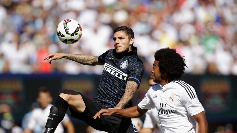Derik Osede (right) in action during a Real Madrid friendly against Inter Milan