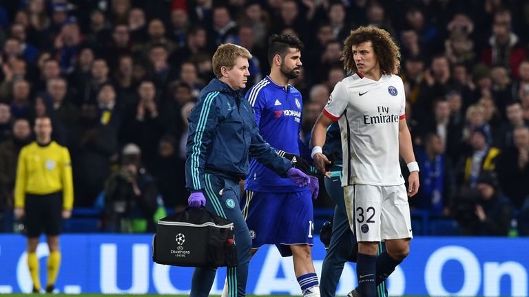 Paris Saint-Germain defender David Luiz (R) shakes hands as Chelsea striker Diego Costa (C) leaves the pitch substituted