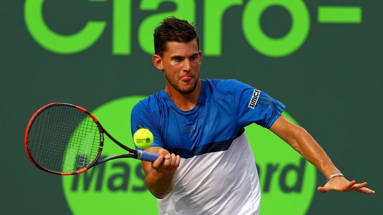 KEY BISCAYNE, FL - MARCH 29:  Dominic Thiem of Austria plays a match against Novak Djokovic of Serbia during Day 9 of the Miami Open