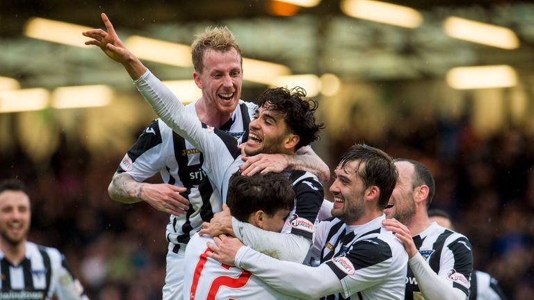 Dunfermline's players celebrate after a hat-trick from Faissal El Bakhtaoui (centre) gave them the League One title