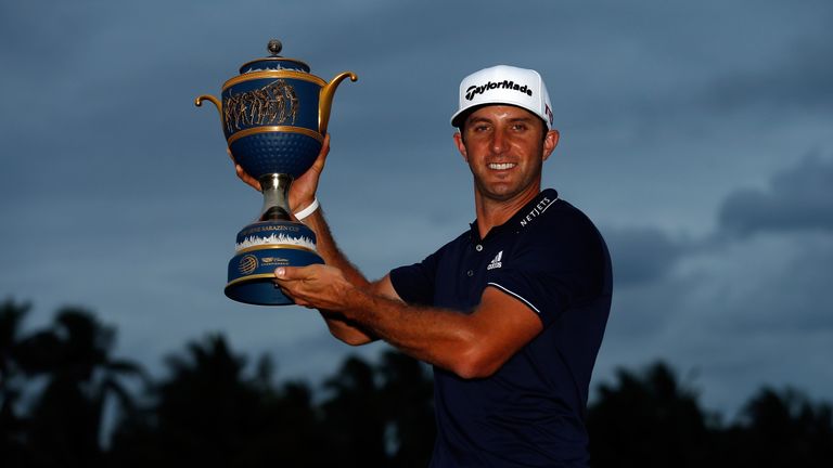 DORAL, FL - MARCH 08:  Dustin Johnson of the United States poses with the Gene Sarazen Cup after winning the World Golf Championships-Cadillac Championship